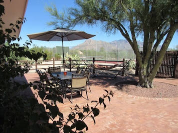 Enjoy your private patio with views of the tennis court and mountains beyond.  