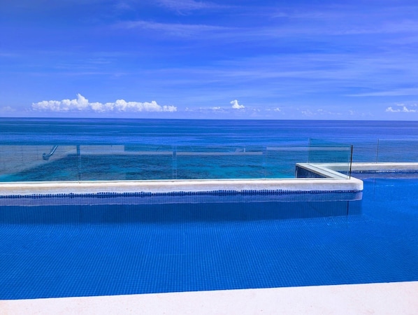 Outdoor pool - Luxury two bedroom ocean front condo at Isla 33 (Isla Mujeres)