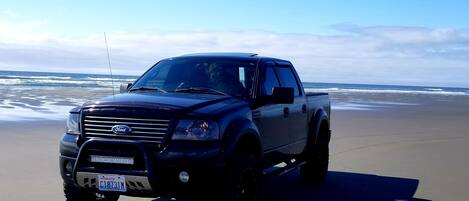 On the beach, sun loungers, beach towels