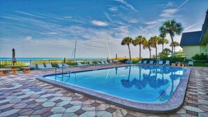 Outdoor pool, a heated pool, pool loungers - Newly Remodeled Beautiful Beachfront direct view of the Gulf and a heated pool. (Indian Rocks Beach)