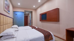 A hotel room with two beds, a TV mounted on the wall, and a door leading to another room. - Sucha Hotel Chongqing N. Railway Station (Chongqing)
