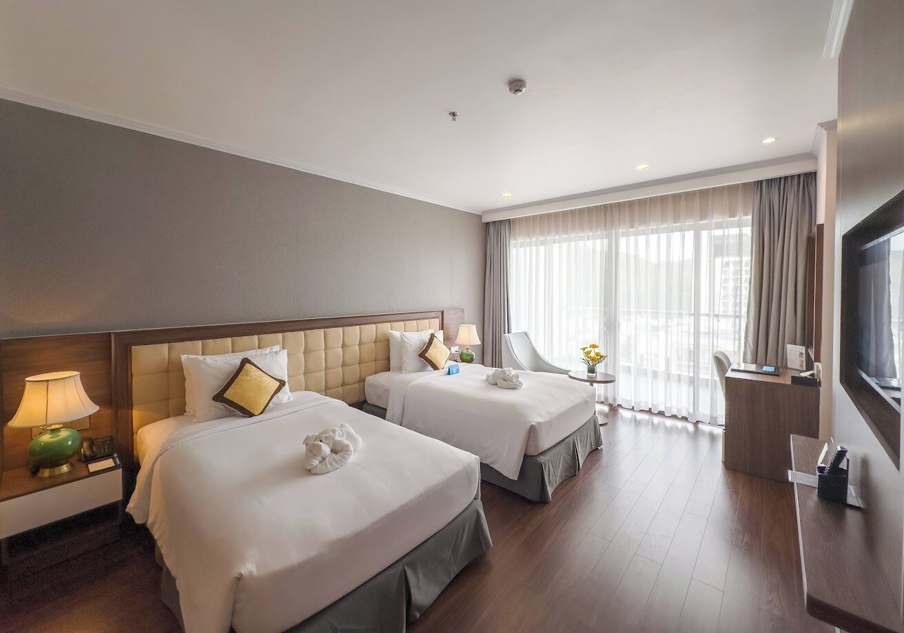 Deluxe Twin Room, Sea View | Minibar, in-room safe, soundproofing, iron/ironing board