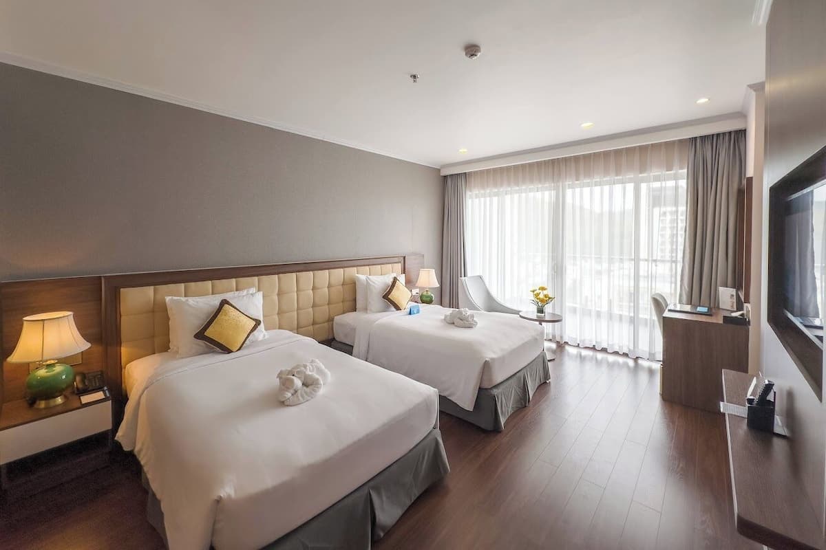 Deluxe Twin Room, Sea View | Minibar, in-room safe, soundproofing, iron/ironing board