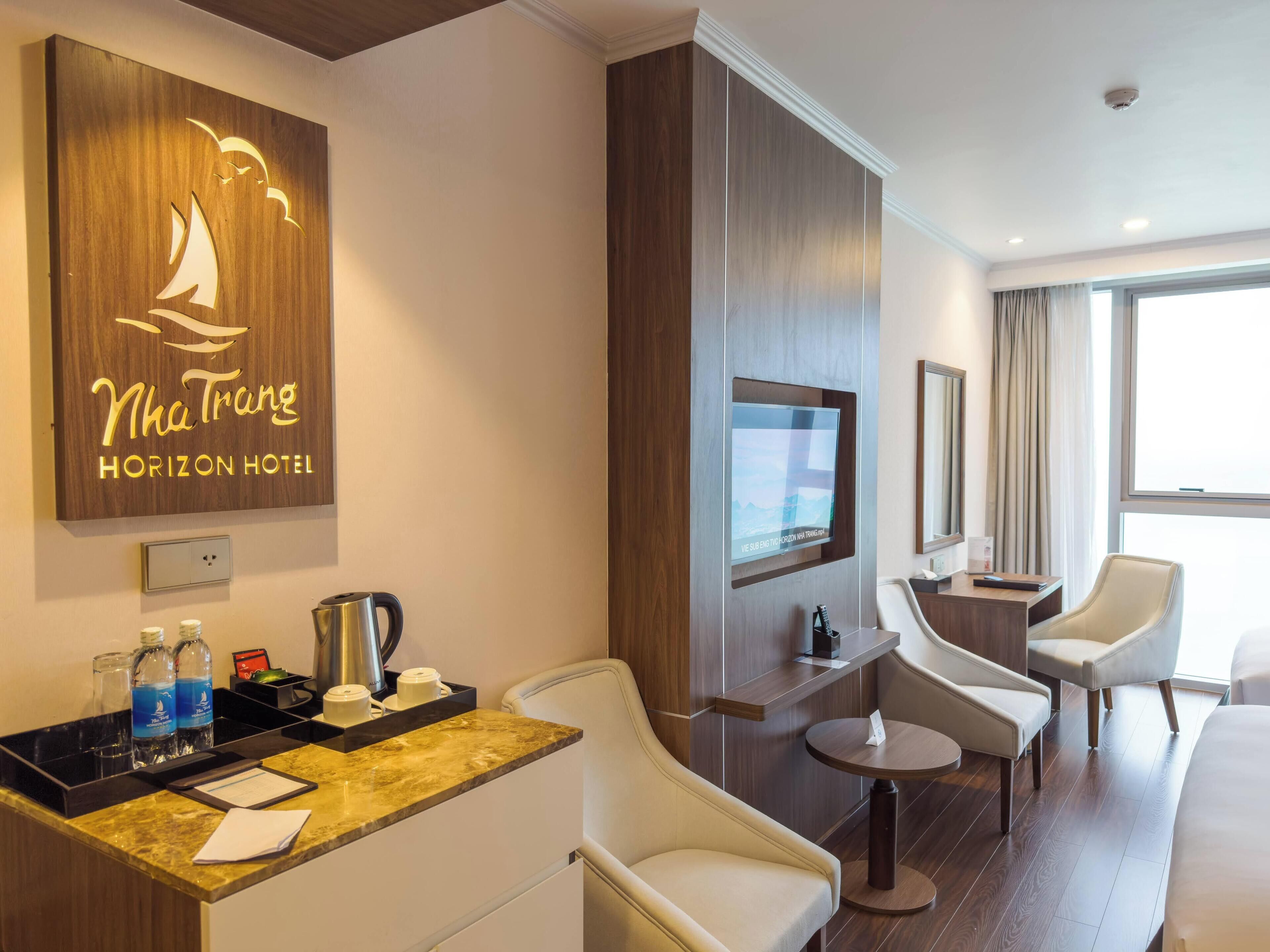 deluxe triple room, ocean view | minibar, in-room safe, soundproofing, iron/ironing board