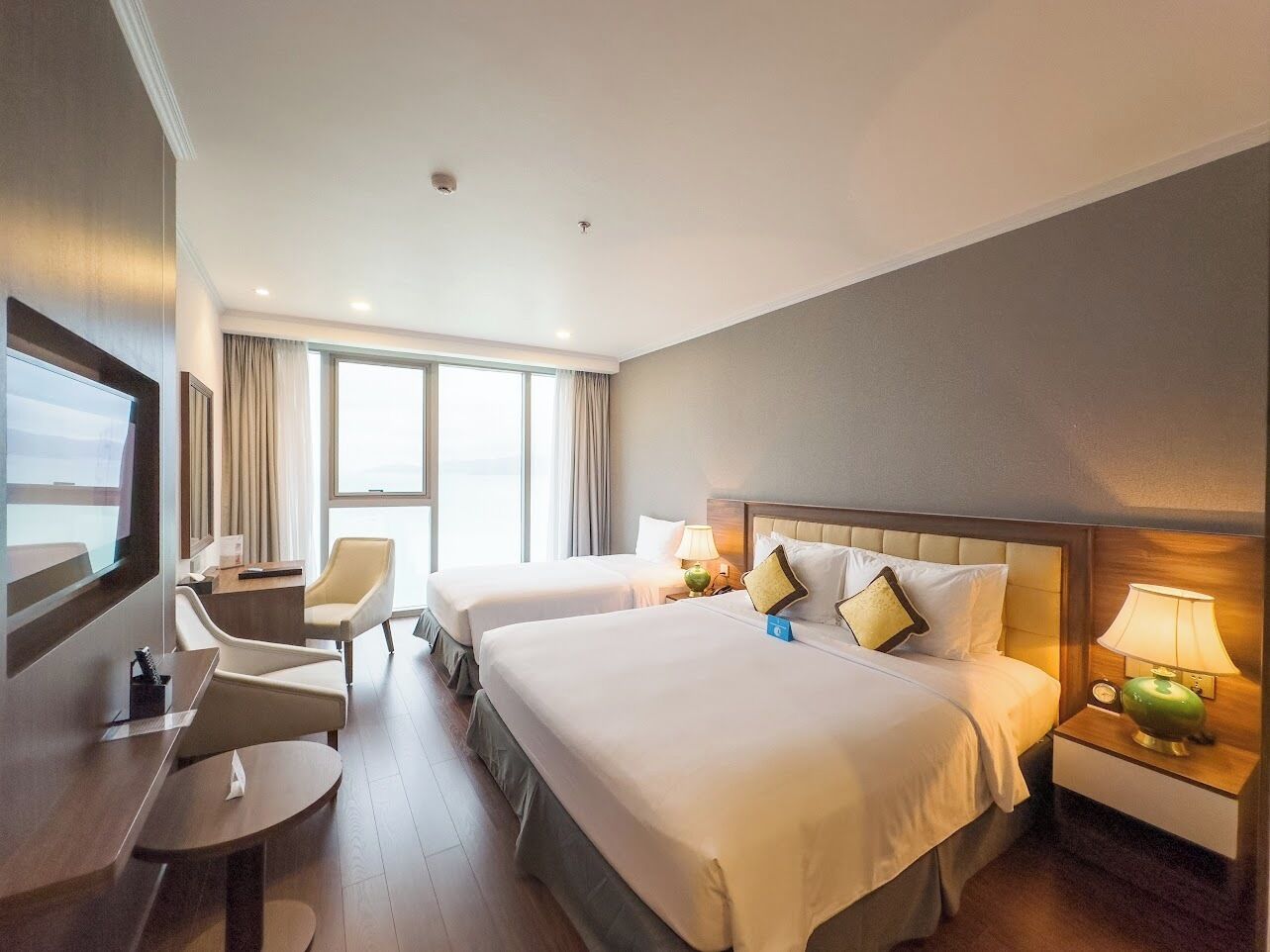 Deluxe Triple Room, Ocean View | Minibar, in-room safe, soundproofing, iron/ironing board