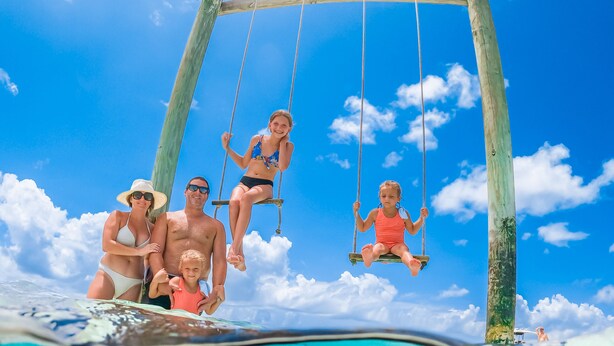 A wooden swing set over a clear blue sea with a stingray in the foreground. - Paradise Found,GREAT LOCATION,free golfcart, dishwasher, sup, kayak, rain water  (Spanish Wells)