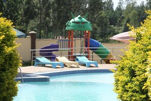 Outdoor pool, open 10:00 AM to 6:00 PM, pool umbrellas, sun loungers