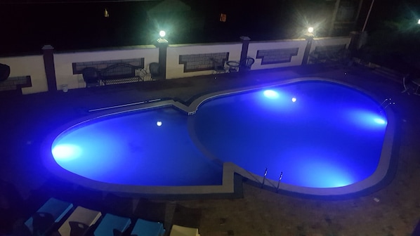 Outdoor pool, open 10:00 AM to 6:00 PM, pool umbrellas, pool loungers