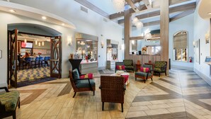 A spacious lobby with high ceilings, modern furniture, and a central seating area. - ChampionsGate, 9 Bed Superb Luxury Villa, Sleeps 34, South Facing Pool/Spa. (ChampionsGate)