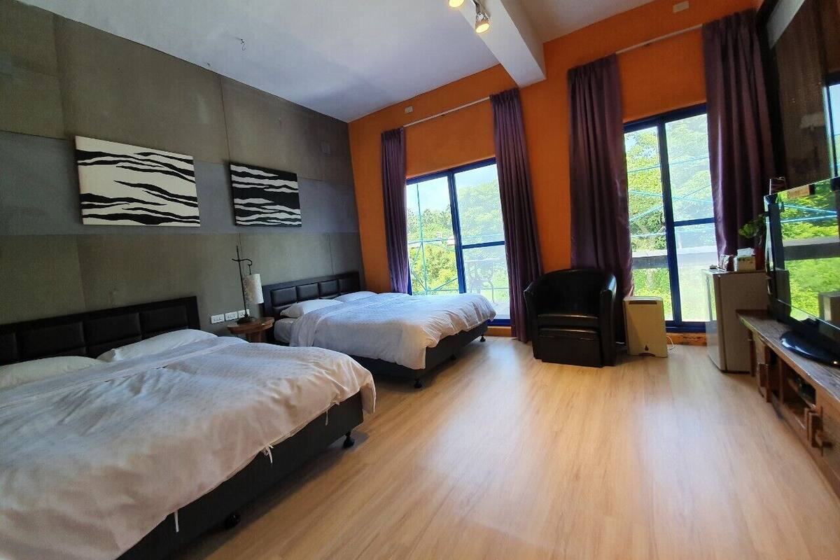 Habitación cuádruple familiar | Edredones de plumas, cortinas opacas, sistema de insonorización