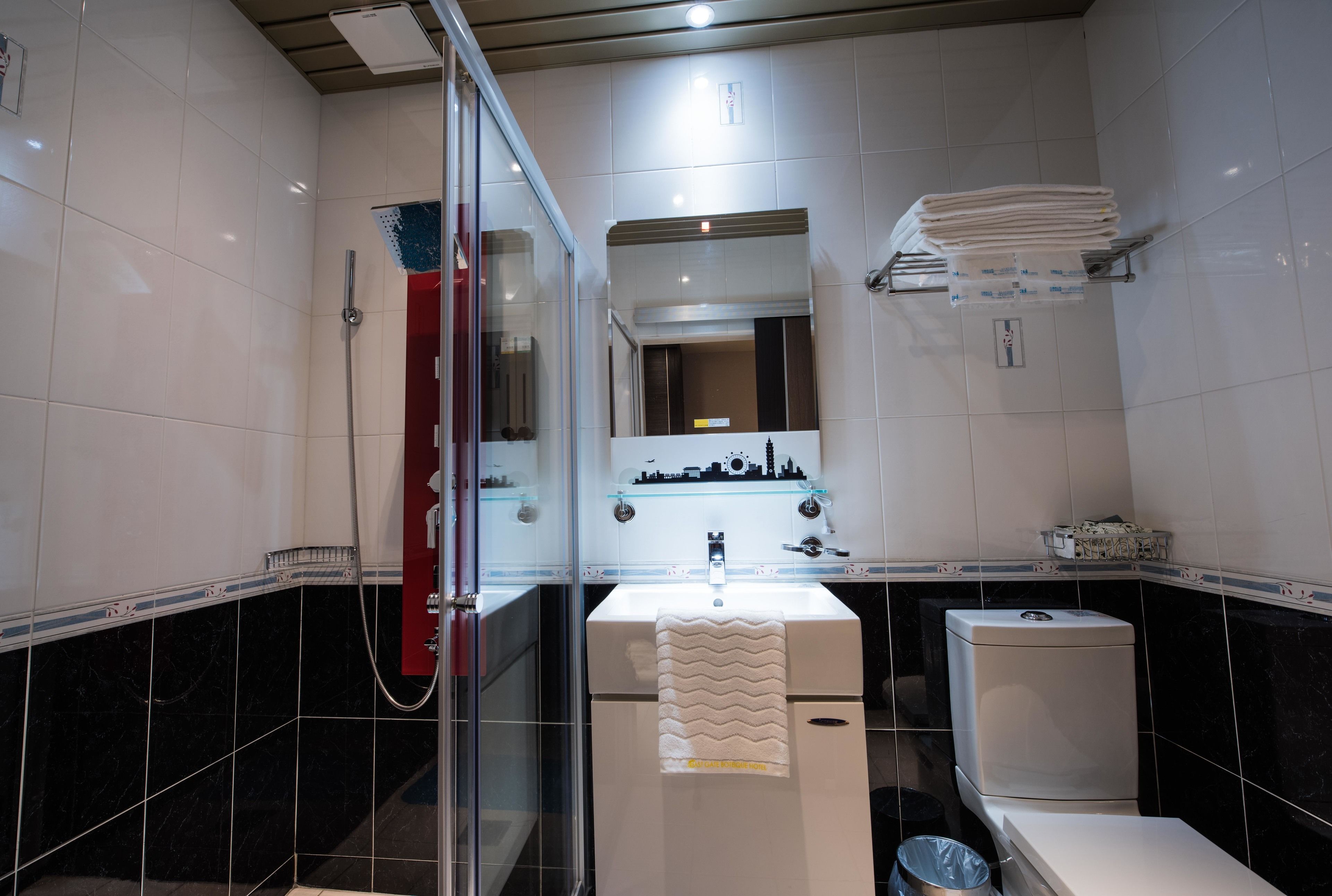 deluxe quadruple room | bathroom | shower, free toiletries, hair dryer, slippers