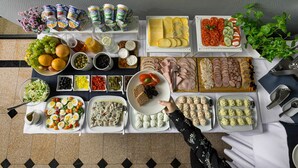 A buffet table with various food items including fruits, cheeses, meats, and salads. - Akacja Medical Resort (Ciechocinek)