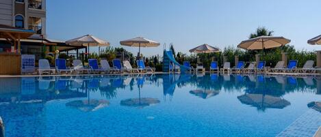 Seasonal outdoor pool, pool umbrellas, pool loungers