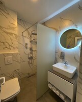 Shower, free toiletries, hair dryer, slippers