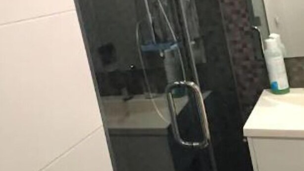 A bathroom with a glass shower enclosure, a white sink, and a mirror. - House for 2 Adults 2018 (Donostia)