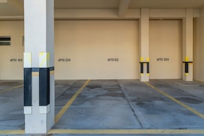 A parking garage with multiple parking spaces, each marked with a number.
