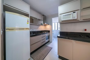 Apartamento | Cozinha privada | Geladeira, micro-ondas, liquidificador