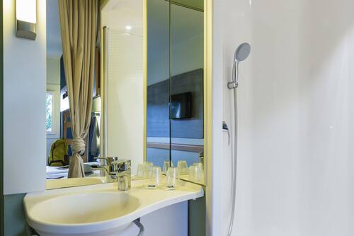 Shower, eco-friendly toiletries, hair dryer, towels