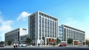 A modern building with a symmetrical facade, large windows, and a central entrance. - Zhoucun Shaobing Hotel (Zibo)