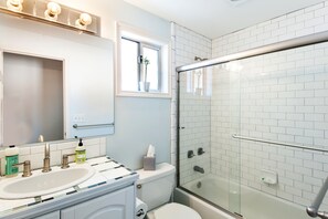 Combined shower/bathtub, jetted bath, hair dryer, towels - Huge Home a Block from Green Lake (Seattle)