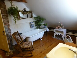 Bathtub, towels, soap, toilet paper