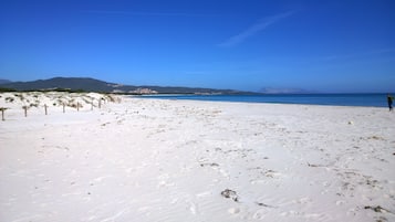 On the beach, sun-loungers