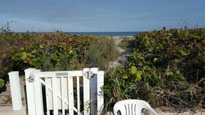 A white gate with a sign that reads "PLEASE KEEP DOOR CLOSED." - Lovely Ocean Views! (Cocoa Beach)