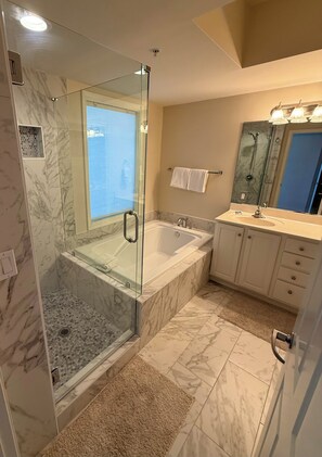 Combined shower/tub, hair dryer, towels, toilet paper