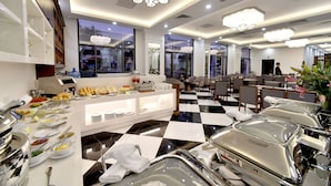 A hotel dining area with buffet-style service, check-in counters, and a check-in desk. - Garco Dragon Hotel 2 (Hanoi)