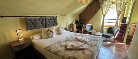 Habitación superior | Ropa de cama de alta calidad y decoración personalizada