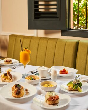 Breakfast, lunch served; international cuisine, al fresco dining 