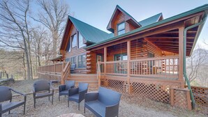 A log cabin with a porch, outdoor seating, and a fire pit. - Deck & Mtn Views! Luxe Log Cabin in Waynesville (Waynesville)
