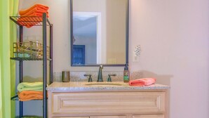 A bathroom with a vanity, a mirror, and a towel rack. - PRIVATE BOAT DOCK AND ONLY 8 STAIRS TO THE WATER (Wedowee)
