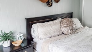 A neatly arranged bedroom with a bed, bedside tables, a clock, and decorative baskets on the wall. - ** Close to Sight and Sound Theater<br>Mother's day weekend available  (Ronks)