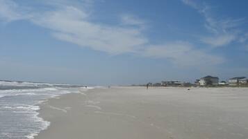 On the beach, sun loungers, beach towels
