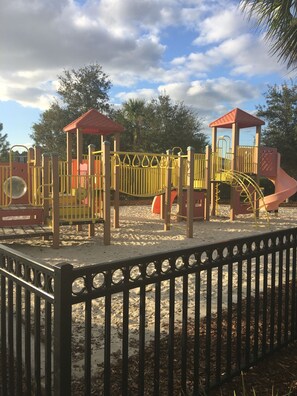 Kids can play on the slides, climb and explore the playground shelter.