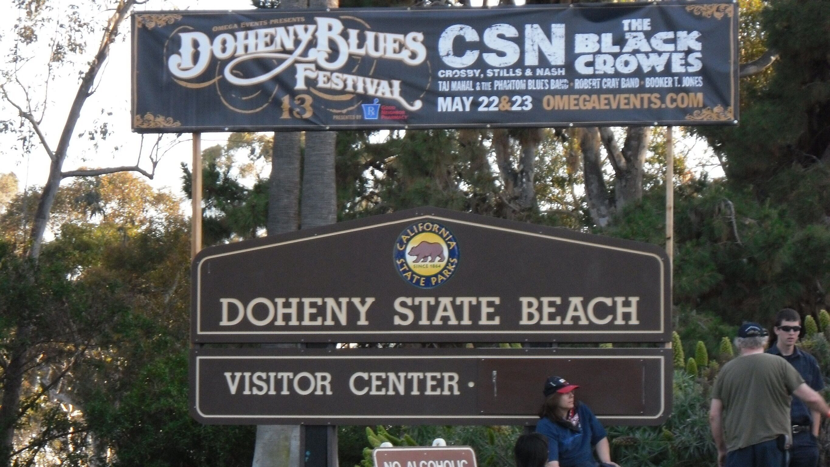 A sign for the Doheny Blues Festival and the Visitor Center at Doheny State Beach.