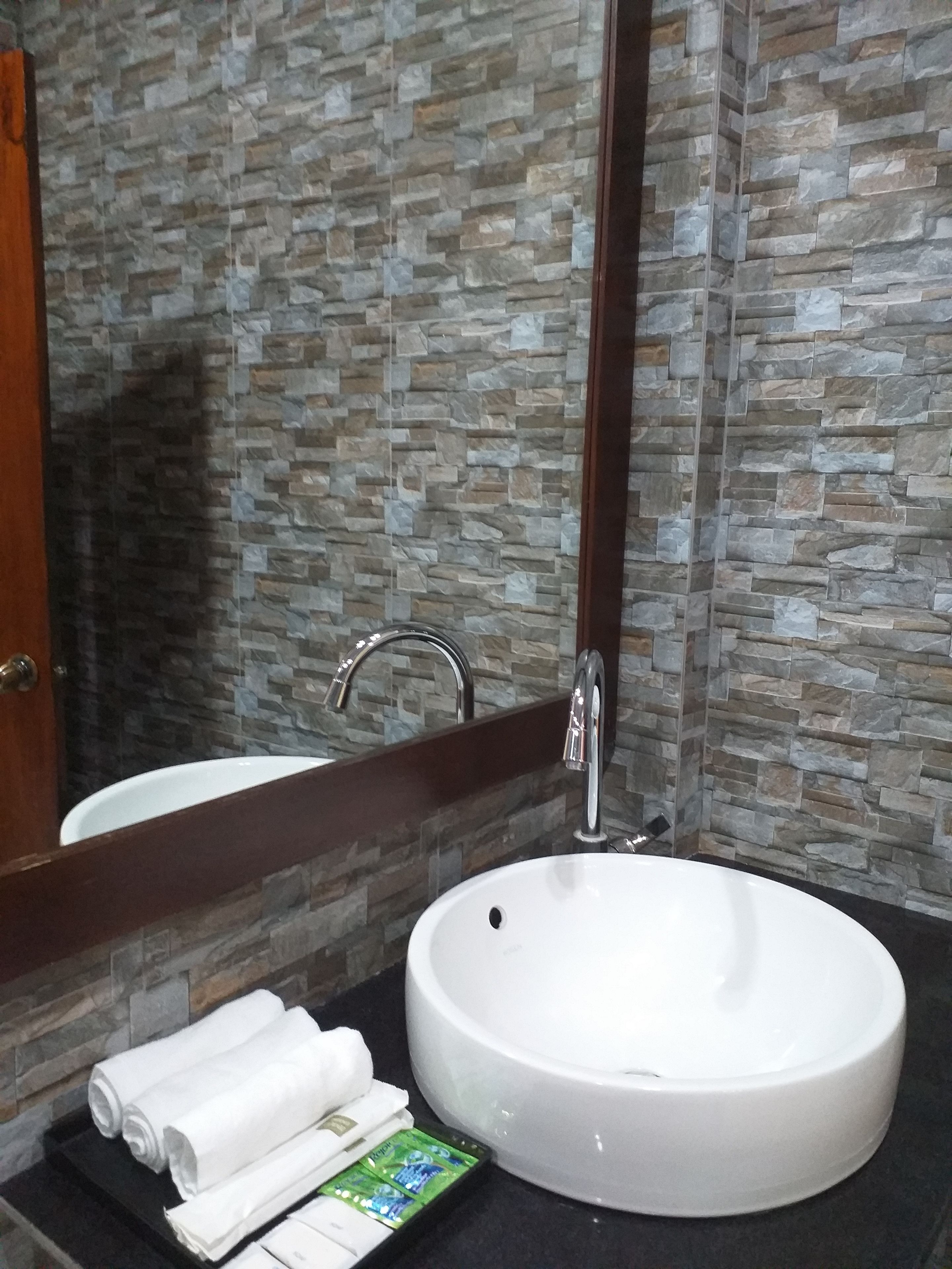 junior triple room, 1 bedroom, balcony, city view | bathroom | shower, free toiletries, slippers, towels