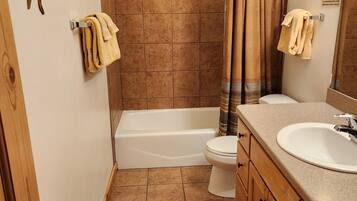 Combined shower/bathtub, hair dryer, towels, soap