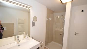 Shower, hair dryer, towels, toilet paper