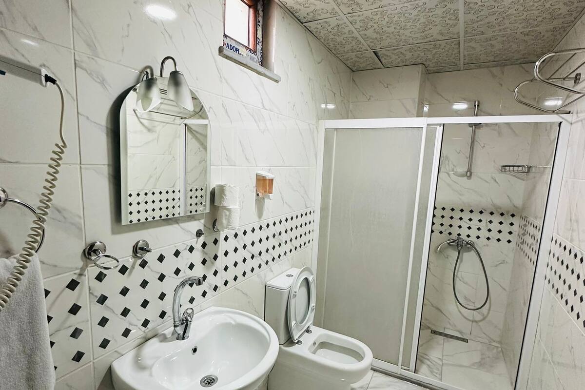 shower, free toiletries, hair dryer, slippers