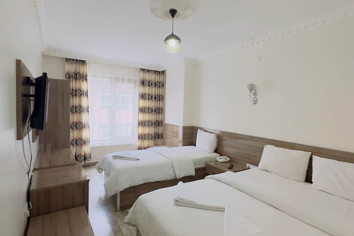 comfort triple room, non smoking, city view | minibar, laptop workspace, blackout curtains, soundproofing