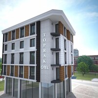 Um edifício moderno de hotel com fachada branca, várias janelas e uma placa com a inscrição 'TOPRAK HOTEL'.