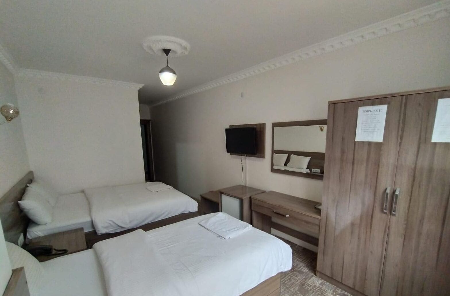 comfort triple room, non smoking, city view | minibar, laptop workspace, blackout curtains, soundproofing
