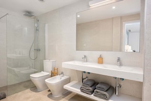 Shower, hair dryer, towels, soap