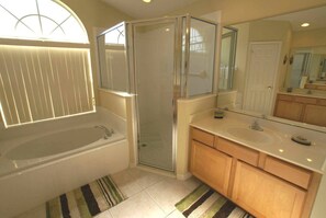 Combined shower/bathtub, hair dryer, towels, soap