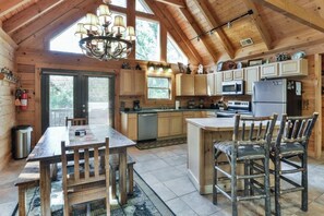 Enjoy meals in this well-equipped kitchen with a central island and dining area.