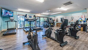 A gym with treadmills, elliptical machines, and stationary bikes. - Stunning Ocean View from top floor Admirals Row 402  (Hilton Head Island)