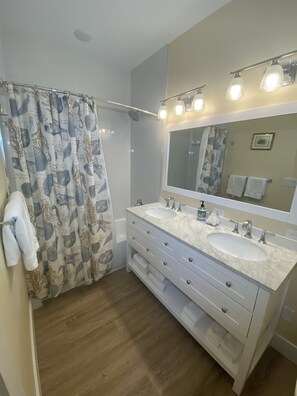 Combined shower/tub, hair dryer, towels, soap