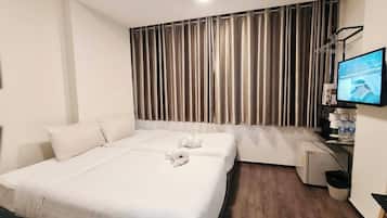Quarto triplo luxo | Roupas de cama premium, frigobar, cofres nos quartos, Wi-Fi de cortesia